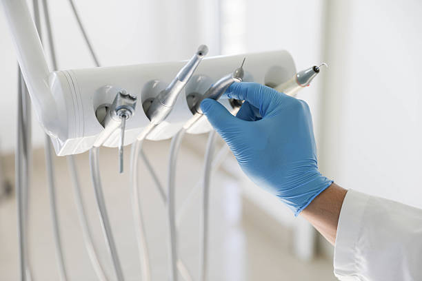 Professional Tooth Extraction technician working in St. Paul, MO